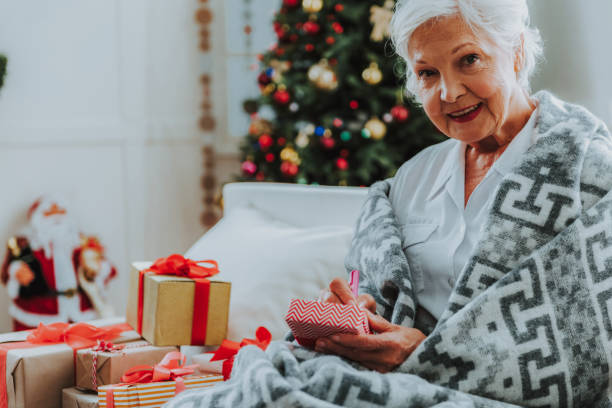 istock Happy elderly woman is resting at home 1171326212