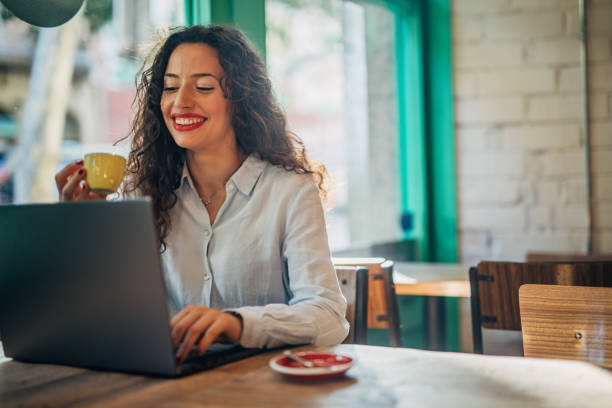 istock Businesswoman Using Laptop In Cafe 1171329151