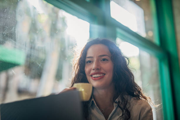 istock Businesswoman Using Laptop In Cafe 1171329254