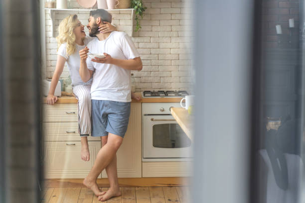 istock Married couple having fun in the kitchen 1171330376