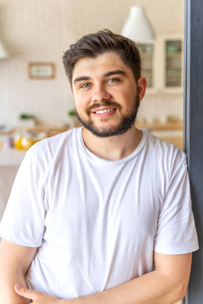 istock Smiling bearded man is posing at home 1171330394
