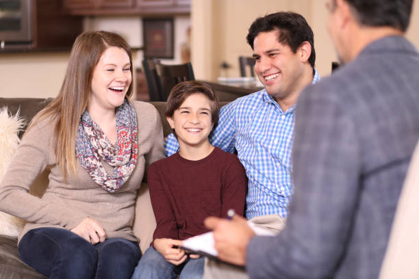 istock Family counseling session at home with therapist. 1171331123