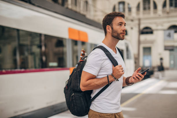 istock Man waiting for train at station 1171331725
