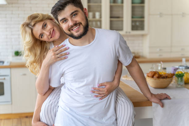 istock Happy young couple is looking at camera 1171332223