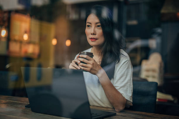 istock Young woman working on laptop in cafe 1171332279