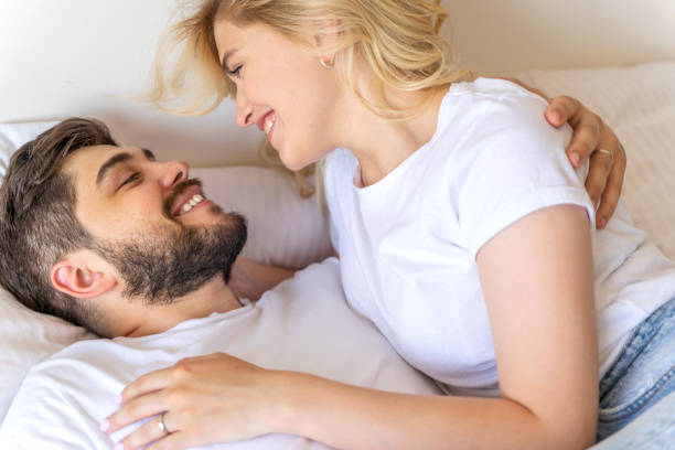 istock Smiling couple is looking at each other 1171332303