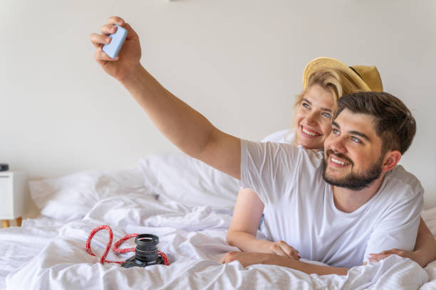 istock Happy couple is making selfie in bed 1171332384