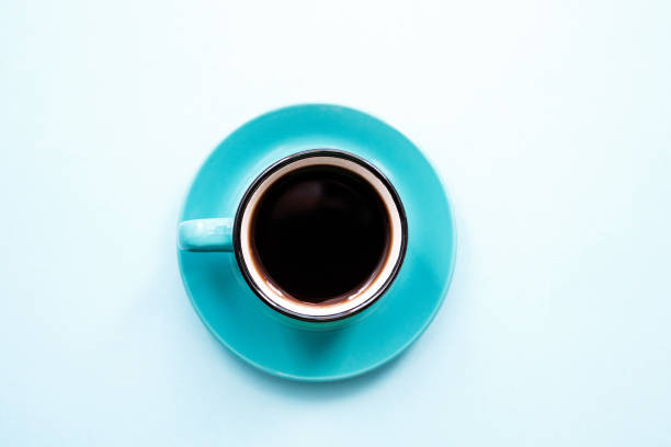 istock blue instant coffee Cup on saucer on blue background close-up, copy space top view flat lay 1171333187
