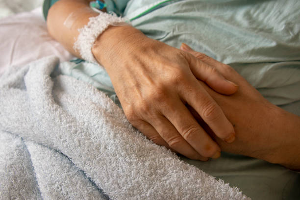 istock Man during an intravenous drip in hospital bed 1171333409