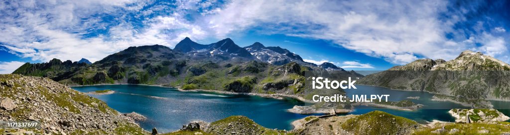 Panorama on the 7 laux lakes and the summits around it The refuge of the "7 laux" is situated between the last lakes and is a real place of heaven. The "Rocher blanc" which is on the photography is the second highest summit of Belledonne. Isere Stock Photo Panorama on the 7 laux lakes and the summits around it The refuge of the "7 laux" is situated between the last lakes and is a real place of heaven. The "Rocher blanc" which is on the photography is the second highest summit of Belledonne. Isere Stock Photo