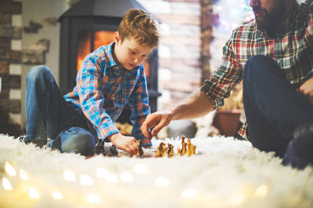 istock Father and son enjoying Christmas holidays at home 1171340064