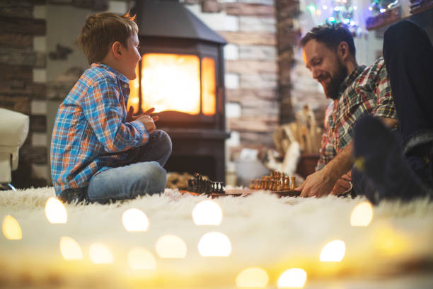 istock Father and son enjoying Christmas holidays at home 1171340066