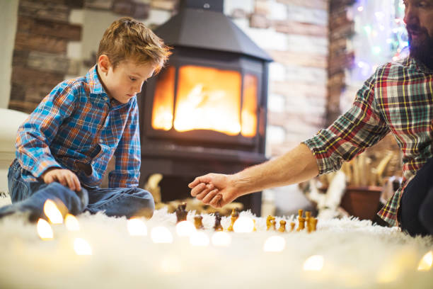 istock Father and son enjoying Christmas holidays at home 1171340076