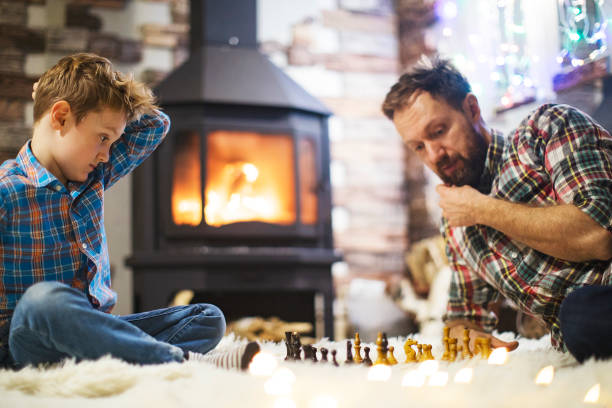 istock Father and son enjoying Christmas holidays at home 1171340078
