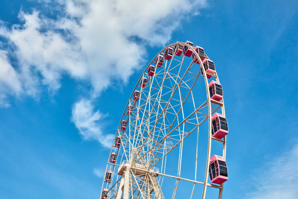 istock Ferris wheels spinning in the sky at the playground 1171340208
