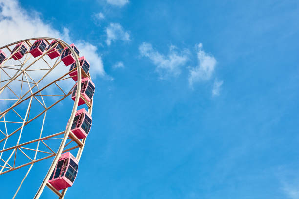 istock Ferris wheels spinning in the sky at the playground 1171340541