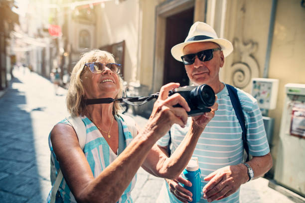 istock Senior couple sightseeing small Italian town 1171341311