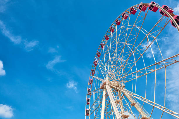 istock Ferris wheels spinning in the sky at the playground 1171341339