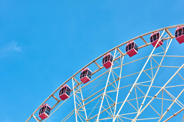 istock Ferris wheels spinning in the sky at the playground 1171341383