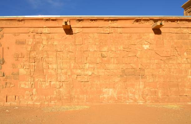 Apedemak Lion Temple, Musawwarat es-Sufra, Sudan - UNESCO World Heritage Site - south wall Musawwarat es-Sufra, Northern State, Sudan: Apedemak Lion Temple, erected by King Arnekhamani and dedicated to Apedemak, a lion-headed warrior god - Meroitic temple complex, Island of Meroe UNESCO World Heritage Site - southern wall bas releif - king Arnakhamani and a prince protected by the goddess Isis, venerating several gods archaelogy stock pictures, royalty-free photos & images