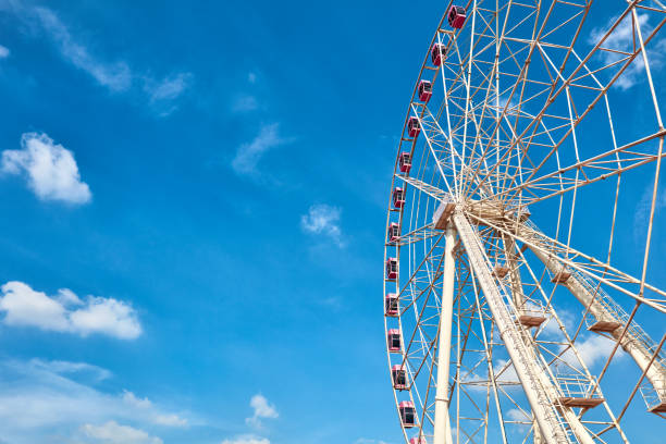 istock Ferris wheels spinning in the sky at the playground 1171341624