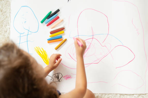 istock Little Girl drawing 1171343242