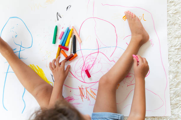 istock Little girl drawing 1171343307
