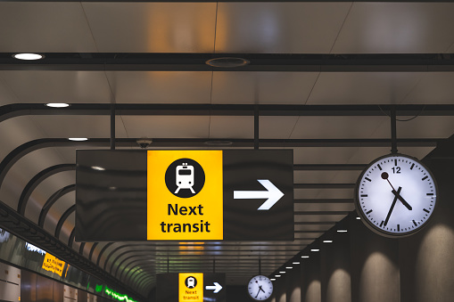London, United Kingdom - August 18, 2019: Directional sign to railway or mass transit platform at Terminal 5, Heathrow Airport, London, England.  The building was opened in 2008 and built to a design of the Richard Rogers Partnership.