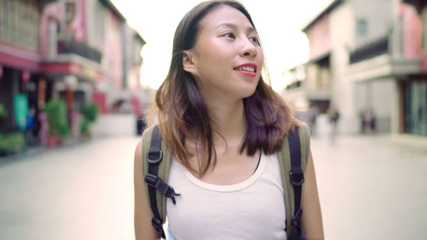 istock Cheerful beautiful young Asian backpacker woman direction and looking on location map while traveling at Chinatown in Beijing, China. Lifestyle backpack tourist travel holiday concept. 1171351513