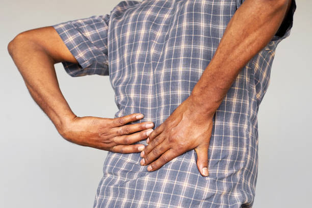 istock Elderly african man, pain at lower back. 1171354697