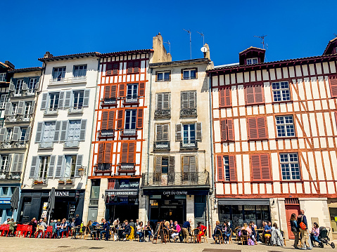 Bayonne, France - May 06, 2019: People relaxing in outdoors cafes in Bayonne