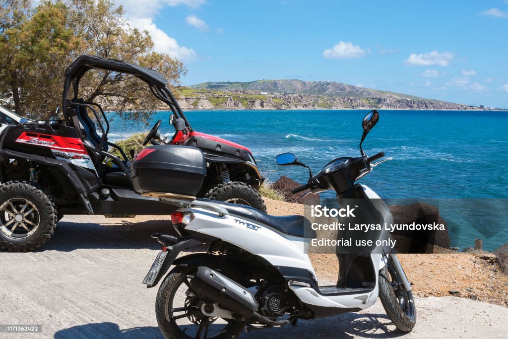 Santorini 2019 Scenic View Of The Turquoise Sea Blue Sky Clouds On The Island Santorini Greece Rent A Vehicle For Travel Atv And Scooter Greek Travel Stock Photo -