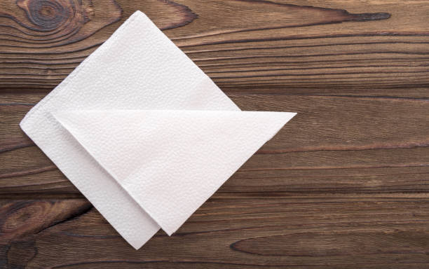 istock paper napkins in white on the background 1171364032