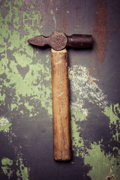 istock old and scratched hammer on metal surface 1171364660