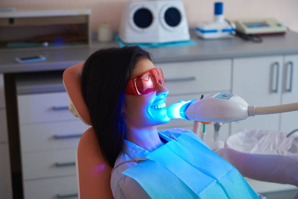 istock Happy lady wearing protective glasses in dentistry 1171365216