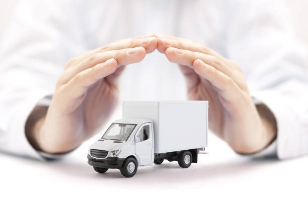 istock Cargo delivery truck protected by hands 1171367431