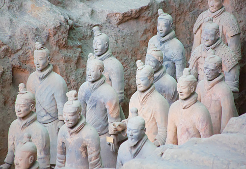 Famous Terracotta Army in Xi'an, China. The mausoleum of Qin Shi Huang, the first Emperor of China contains collection of terracotta sculptures of armored men and horses.