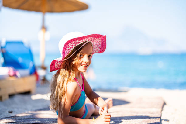 istock Beautiful girl lying at the beach 1171373191
