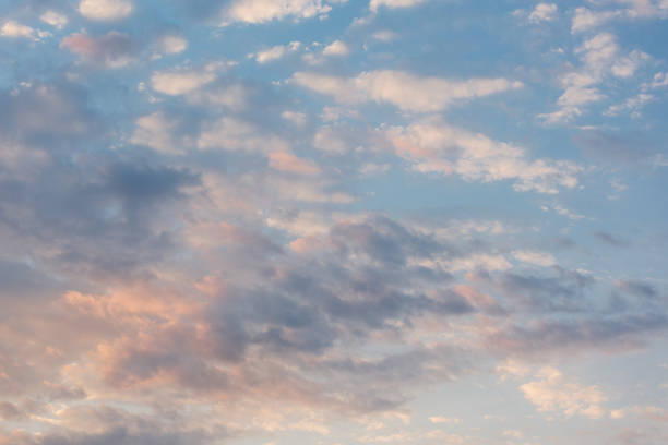 istock delicate pink clouds illuminated by morning sun, early morning 1171375025