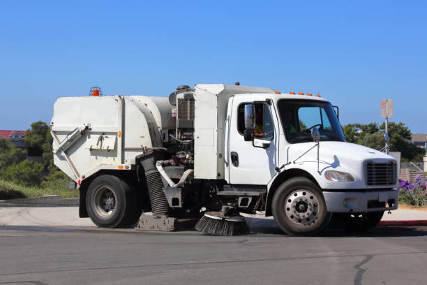 Street Sweeper, Sweeping the Street A city street sweeper, sweeping a street that drains into the ocean. street sweeper stock pictures, royalty-free photos & images