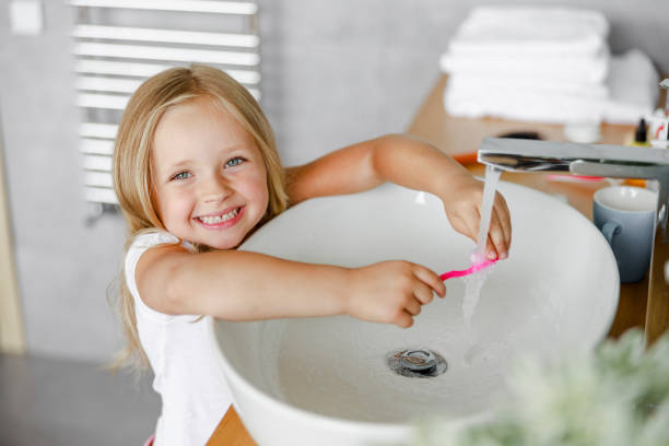 istock Happy girl is going to brush her teeth 1171379344
