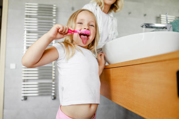 istock Mom and daughter having fun in the bathroom 1171379387