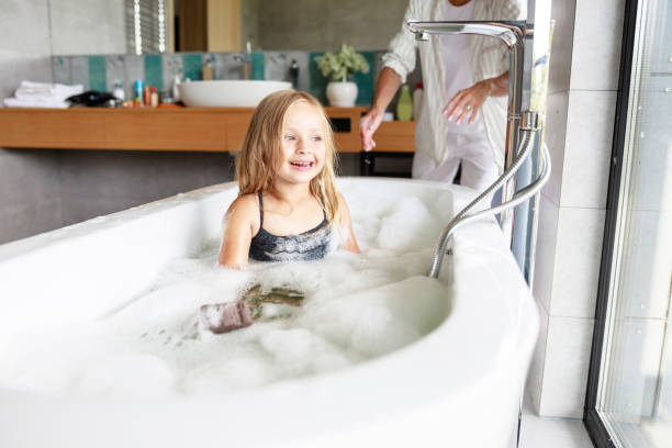 istock Little girl having funny time in bath 1171380427