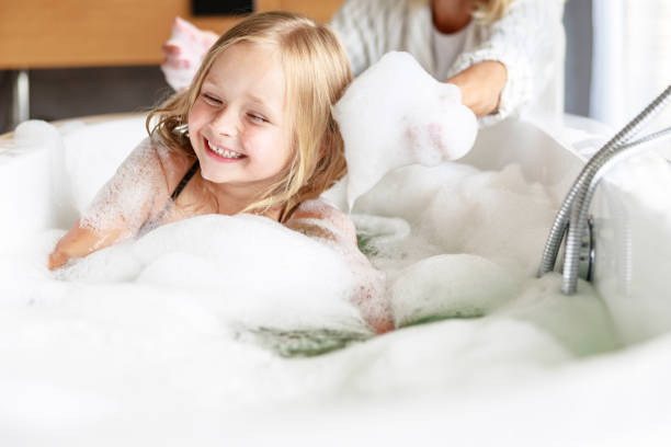 istock Mom having fun with foam in her hands 1171380429