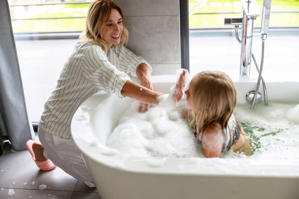 istock Mother in pajamas plays with her daughter 1171380438