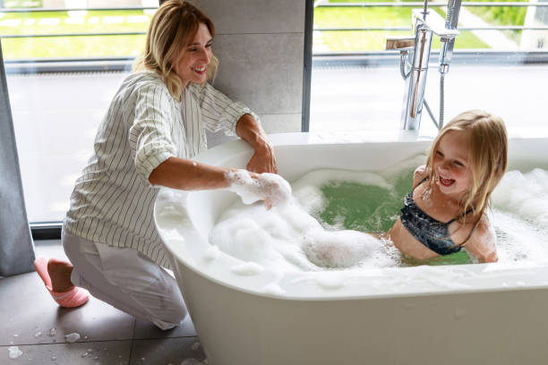 istock Happy girl laughing fun in the bath 1171380442