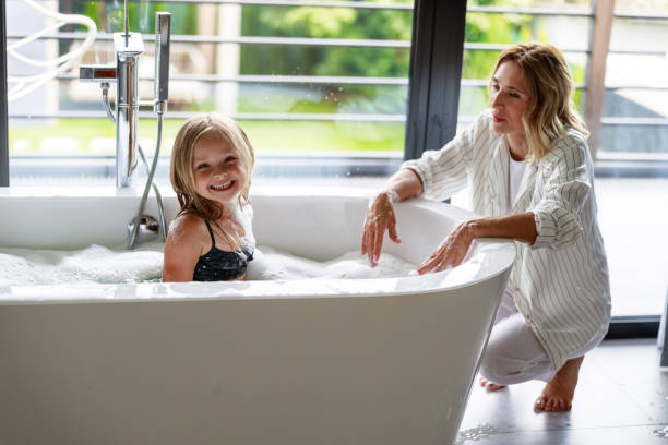istock Happy girl in bath looking at camera 1171380517