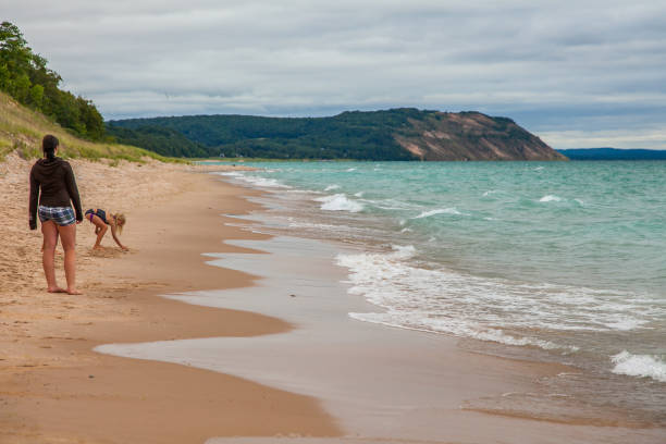 visitors tackle the Dune Climb, 450 feet sand dune on the lakeshore of Sleeping Bear Dunes National Lakeshore on Lake Michigin.
