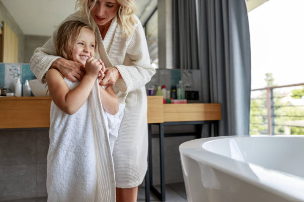 istock Happy mom hugging daughter in the bathroom 1171385199