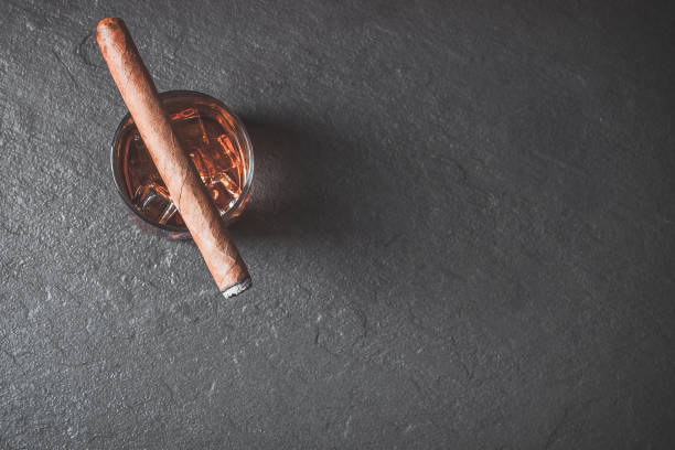 istock Whiskey with ice and cigar. Top view with copy space 1171393251